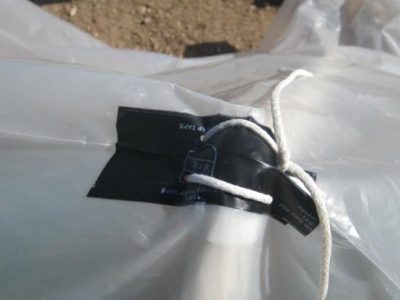 plastic sheet tied to pvc pipe